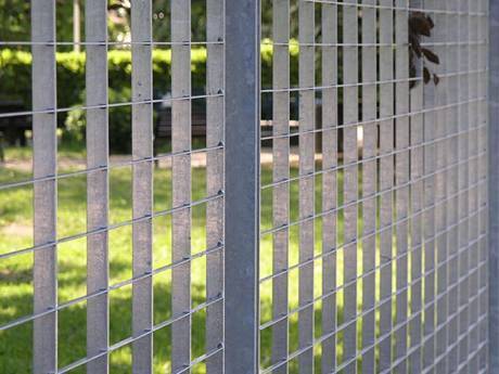 A part of galvanized press locked steel grating fence.