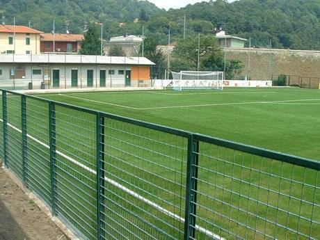 Green coating steel grating fence around the football field.