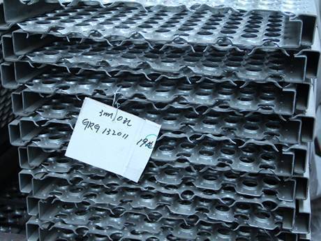 Many O-grip safety grating plates stacked together.