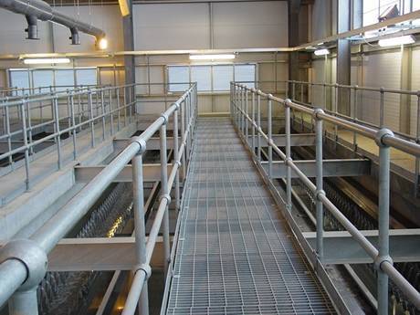 Press locked steel grating walkway was built inside sewage treatment plant.