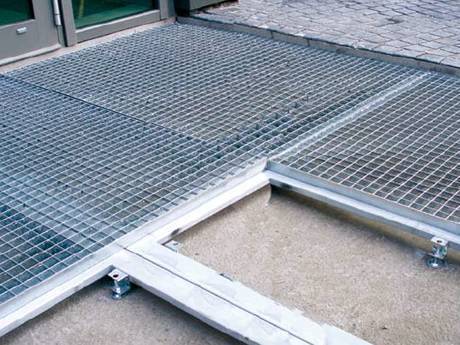 It is a door mat consisting of unframed steel grating and spacing strips pressed together.